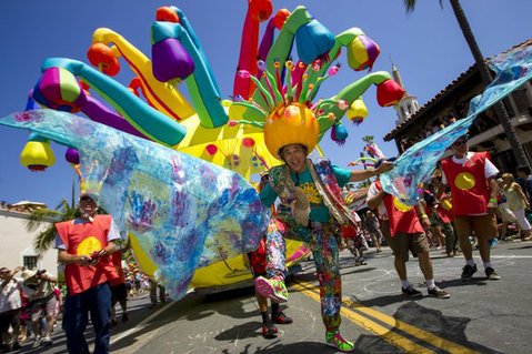 Artist Pali X-Mano shows off his wings in front of ‘Solar Creatures Dance Ensemble,’ an inflatable float he designed for the Summer Solstice parade (June 22, 2013)