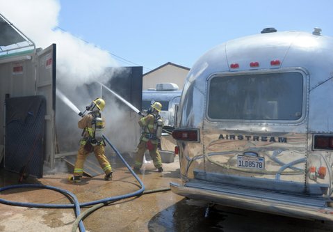 Firefighters douse the small blaze at Hofmann Architecture offices on Quarantina Street