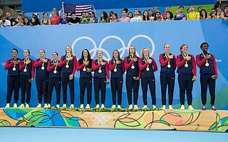 <b>OLYMPIC BLING:</b> The U.S. women’s water polo team wears gold during the awards ceremony at the Rio Olympics. It includes Santa Barbara players Kami Craig (second from right), Kiley Neushul (sixth from right), and Sami Hill (far left).
