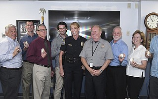 Police Chief Lori Luhnow swears in nine members of the department's new Volunteers in Policing (VIP) initiative