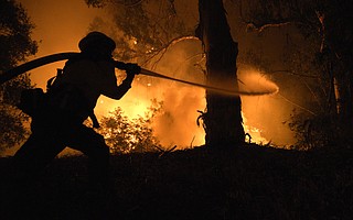 Firefighters battle the Holiday Fire on La Goleta Road. (July 6, 2018)