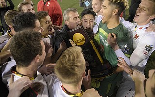Maryland Head Coach Sasho Cirovski (center) celebrates with team members after Maryland beats Akron 1-0 in the 2018 Division I Men's Soccer Championship