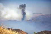 When the wind shifts for a short period, the fire's progress is evident. With Bald Mountain in the background, it is apparent about 25% of the Deck has been burned. Just ahead of the thick black funnel are invaluable archaeological resources.