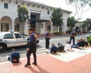 Suspected gang members involved in the stabbing murder of Angel Linares are detained on State Street in March 2007.