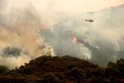 Working three-day shifts on the frontlines of the fire, Hot Shot crews helicopter back to civilization for a few short hours before returning to battle the blaze.