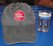 A glass of Russian River Brewing's Pliny the Elder-one of the best double IPAs in the country-sits next to its namesake hat.