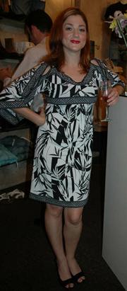 <p><strong>Who:</strong> Jen Smithwick<br/>
<strong>Spotted:</strong> Bryan Lee's Grand Re-Opening</p>
<p>Black and white and hot all over. A glass of celebratory bubbly is the perfect accessory for the Bryan Lee shop owner on her big night.</p>