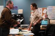 Hank Deerfield (Tommy Lee Jones), the missing soldier's father, and Detective Sanders (Charlize Theron).