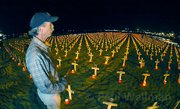 In 2005 Steven Sherrill looks out during one of the rare occasions that the crosses are displayed at night and lit by candles.