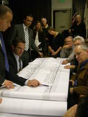 Rick Caruso stands back as his cohorts Matt Middlebrook and Michael McManus unveil the new Miramar plans.