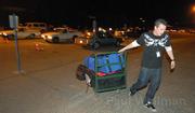 A line of cars deliver ballots from Santa Barbara North County precincts and Bryn Gier carts the results into Earl Warren Showgrounds for processing.