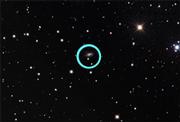 A large-scale image of space, taken by Westmont's Keck Telescope. The upper-right luminous body is a supernova.