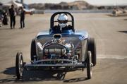 A driver rolls down the back stretch at the end of the Famoso raceway where drivers stop to pick up the printout of their timed run before continuing on to the pits.