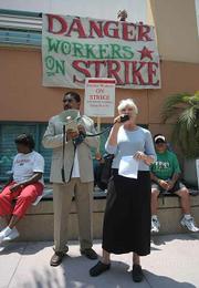 Anne Anderson (right) of Santa Barbara's Clergy and Laity United for Economic Justice (CLUE SB) speaks in support of the strikers