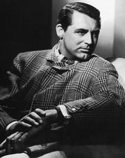 Cary Grant wearing a Prince of Wales checked jacket by Savile Row tailors Kilgour, French & Stanbury.