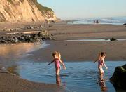 Kids play at Arroyo Burro Beach without worries thanks to the volunteers who help keep it clean each year.