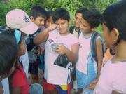 Native children on the Galapagos Island are learning about the archipelago's unique plant life.