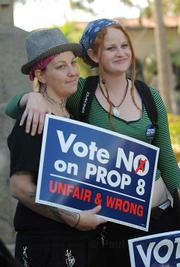 Crystal Harris (left) and partner Devin Barry, who engaged to be married, attend the No on Prop 8 rally at the courthouse