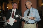 Holland, at left, with assistant Jimbo McClure, checking the results on election night at the courthouse.