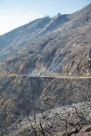 Vegetation along Gibraltar Road has been burned to mineral soil. Residents below on Mountain Drive will face serious threats from next winter's rains.