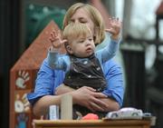 Goleta mom and business owner Carla Abatie-Neufeldt shared concerns about toy safety standards while holding her 11-month-old son, Max, who was simultaneously the most entertained and entertaining part of the CalPIRG press conference.