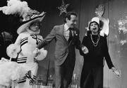 In October 1978, Jose Saria, Supervisor Milk, and Mavis (pictured from left) presented a check from an anonymous donor to purchase uniforms for the first-ever Gay and Lesbian Freedom Marching Band.