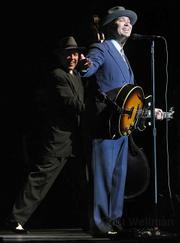 Scotty Morris (right) led Ventura's Big Bad Voodoo Daddy through a set full of Christmas tunes, swing standards, and original compositions last Tuesday night at the Arlington Theatre.