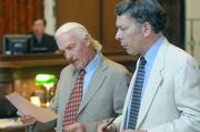 Defense attorney Robert Landheer and prosecutor Darryl Perlin go over Van Tassel's bail agreement