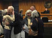 James Wheeler gets hugs from joyful friends and family after being released on probation at his sentencing. Wheeler attempted to kill his dementia-stricken wife and himself in September 2008 to prevent their separation.