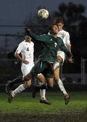 Santa Barbara Don Christian Pardo (foreground) goes up against Dos Pueblos Charger Eduardo Cortez