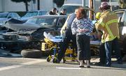 A victim is extracted from her vehicle after being hit by a vehicle that allegedly ran a red light at the intersection of Salsipuedes St. and Haley St.