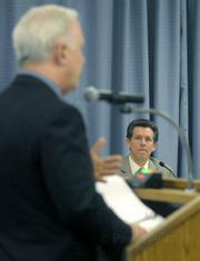 Goleta City manager Dan Singer (center) listens to Steven Amerikaner, attorney for Goleta West, (left) addressing the Goleta City Council