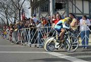 Lance Armstrong flies by screaming fans at the start of the AMGEN time trials in Solvang, CA