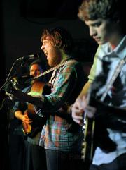 Frontman Robin Pecknold (center) showed off his lauded vocal chops to a sold-out crowd during Monday night's Fleet Foxes show at UCSB's Hub.