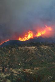 Looking from Tea Fire area (Conejo Road) toward Jesusita Fire burning in Rattlesnake Canyon (road is West Mountain Drive)