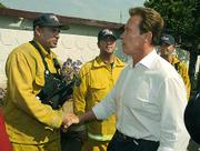 Governor Schwarzenegger takes time before a press conference on the Jesusita Fire to shake a few hands of the fire fighters from Cal Fire