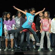 Students from Solvang Elementary and Cesar Ch¡vez Charter School rehearse at the Marjorie Luke Theatre.