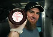 Michael shows a jar of Mama's Preserves jalape±o jelly from Farmers Market, a key ingredient in the Burger Bus's CB&J