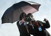Michael Jackson (left) on top of his SUV outside the Santa Maria Courthouse in Jan. 2004