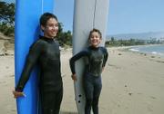 Columbian born Andres (left) and childhood friend Miguel Angel Weedn pose at Ledbetter Beach after a morning of surfing