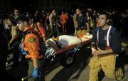 First responders rush a medical victim through the crowds in I.V. on halloween 2008
