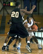 UCSB's Orlando Johnson (holding ball) scored big against Cal State Los Angeles in the Gaucho's November 14 victory.