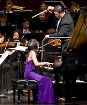 Pianist Yuja Wang performs Rachmaninoff while maestro Long Yu conducts members of the Shanghai Symphony Orchestra at the Granada Theatre.