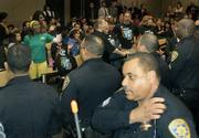 Police remove UC students and employees from the meeting room after their personal pleas in protest of the hikes became, according to regents and officers, out of control. The affirmative vote immediately followed the removal of the livid students and workers.