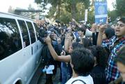 Students and workers storm the first van attempting transport Regent board members to their cars from the meeting place. The vans ultimately were unable to move for many hours, due to protestor-blocked streets.