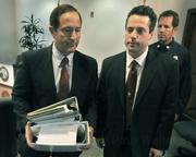 L to R Santa Barbara Senior Deputy District Attorney Jerry Lulejian (left) leaves the Jesusita Fire press conference with a bundle of paperwork related to the case, with former Acting District Attorney Joshua E. Lynn and County Fire PIO Capt. David Sadecki