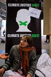 This young lady is from the Climate Justice Action crew. She, as the sign says, hasn't eaten for more than a month. Some of her cohorts are helping organize a "flood" of the Copenhagen streets tomorrow.