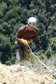 He also cares for California condors, rappelling down cliffs to the birds' remote nests in order to examine condor chicks.