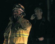Santa Barbara City Battalion Chief Pat Mcelroy (left) and City Fire Chief Andrew DiMizio take calls on the scene at the courthouse fire Jan. 5, 2010