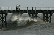 A break in the rain on Tuesday allowed some sightseeing on Goleta Pier though big waves and heavy winds kept most people out of the water Jan. 19, 2010